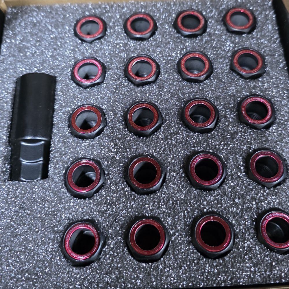 GReddy Performance HR38 wheel nuts in foam tray packaging
