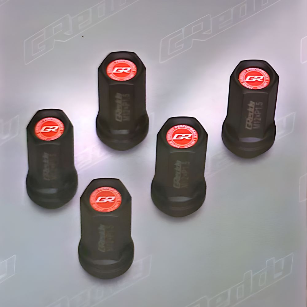 Forged steel GReddy M59P nuts displayed with red logo caps