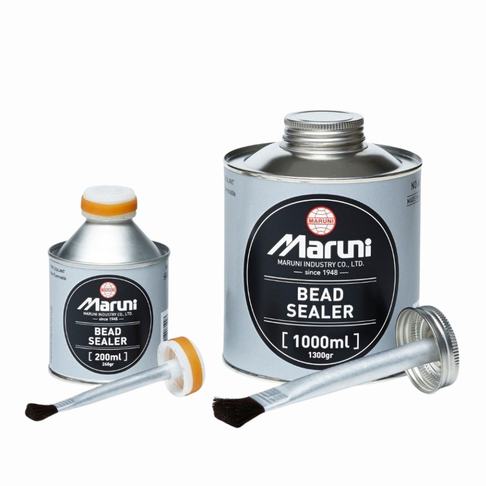 Two cans of Maruni bead sealer with applicators on a white background
