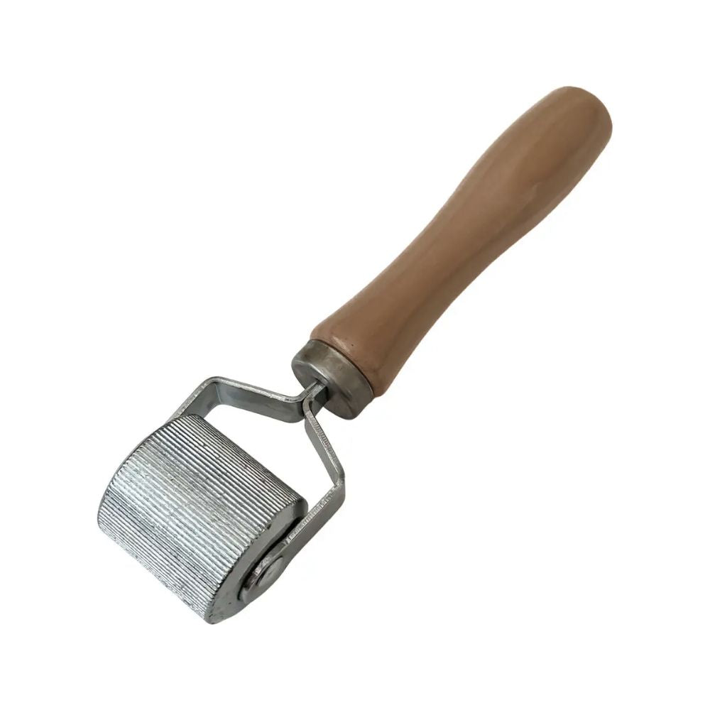 Large roller stitcher with wide textured metal wheel